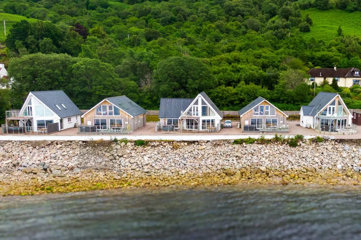 The five Kentallen beach houses along the shore of Loch Linnhe