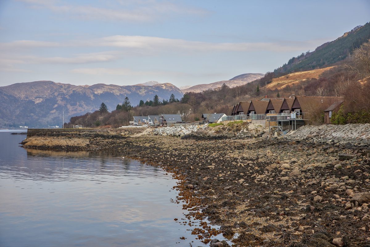 The shoreline at Kentallen with the lodges along the water