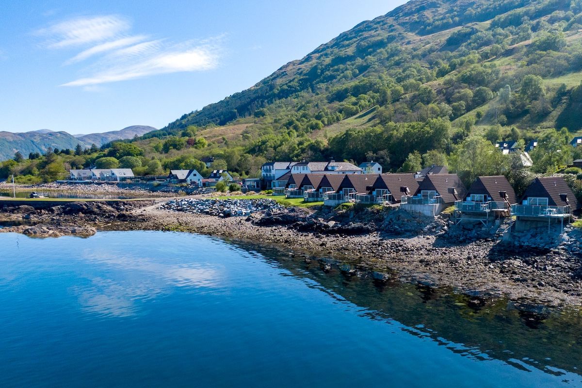 The eight lodges along the shoreline at Kentallen